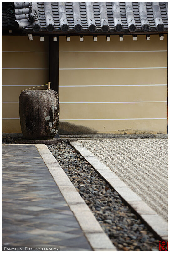 Tsukubai water basin in corner of rock garden, Tokai-in temple, Kyoto, Japan