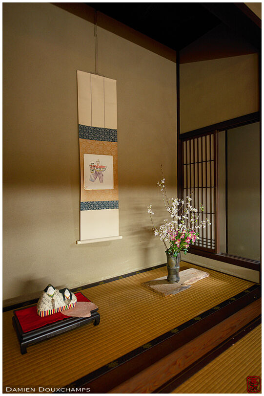 Classic tokonoma alcove with hanging scroll, ikebana flower arrangement and one item placed on display in the Kinoshi house, Nara, Japan
