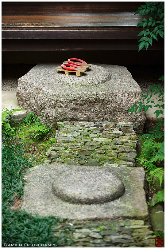 Two large old pillar base stones recycled as elements of the inner garden of the Kinoshi house, Nara, Japan