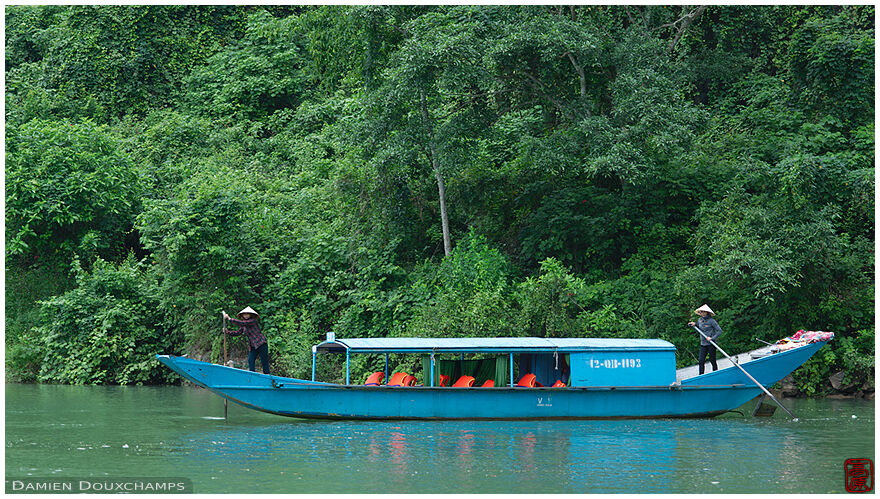 Tourist boat on the river leading to the Phong Nha cave, Viet Nam