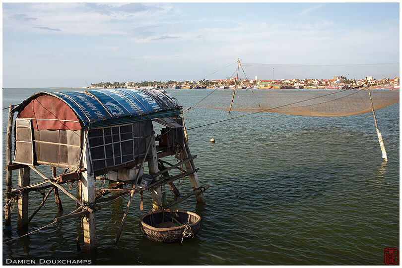 Fisherman hut with its net and little transit boat, Dong Hoi, Vietnam