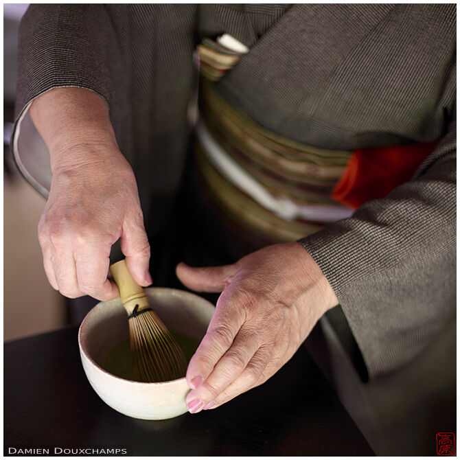 Whisking the tea during tea ceremony in Enko-ji temple, Kyoto, Japan
