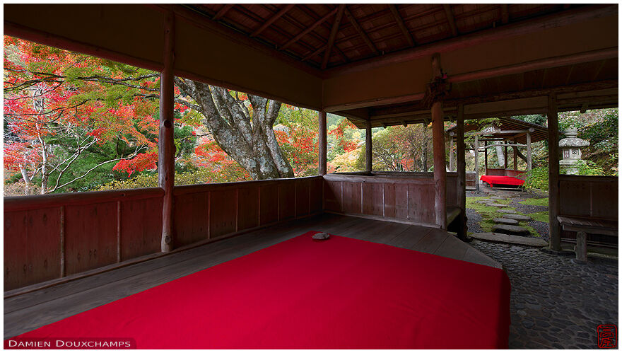 Red carpet on seating areas in pavilions of the Hakuryu-en garden, Kyoto, Japan