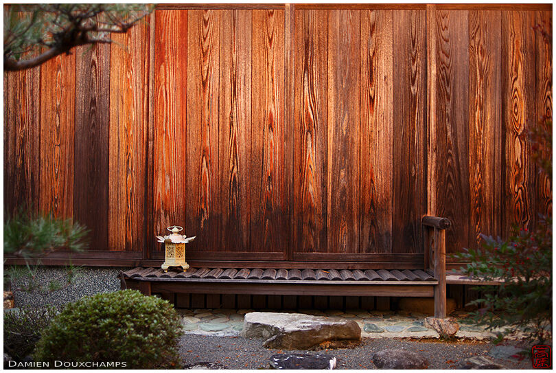 Lone golden lantern in a small inner garden of Shobo-ji temple, Kyoto, Japan