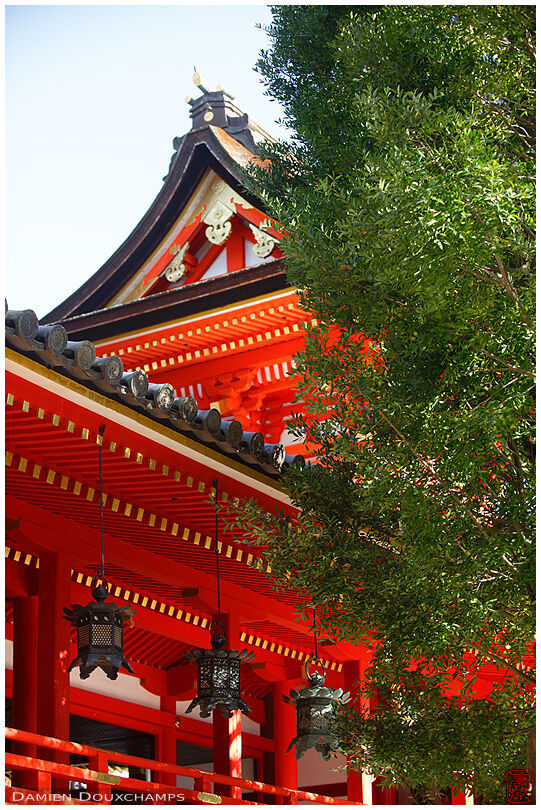 Large metallic lanterns and traditional shrine architecture in Iwashimizu Hachiman-gu, Kyoto, Japan