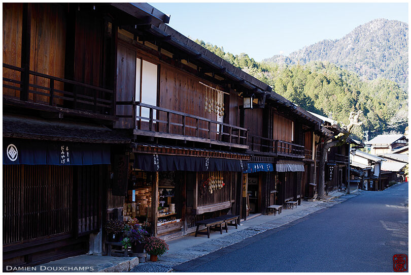 Stores and inns alond the road passing through the old Tsumago village in Nagano, Japan