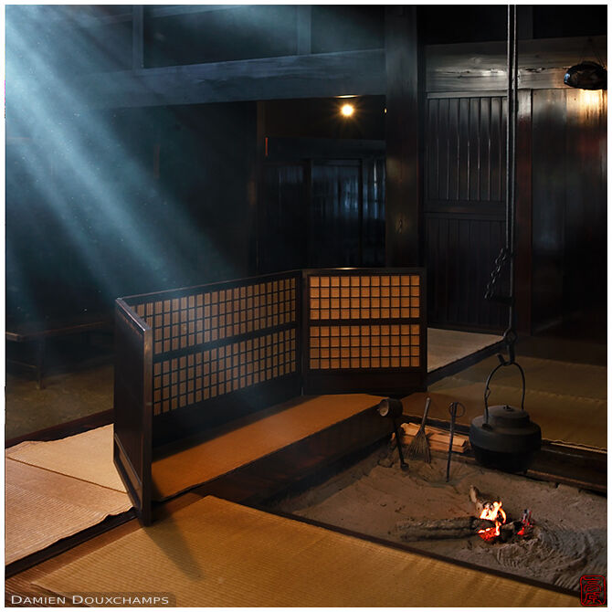 Sun beams in room with burning fire, Tsumago village, Nagano, Japan