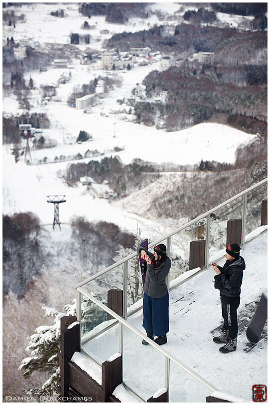 Tourists on elevated terrace in the Ryuoo Ski area, Nagano, Japan