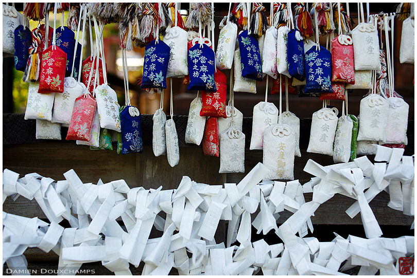 Numerous discarded talismans and discarded fortunes in Taima-dera temple, Nara, Japan