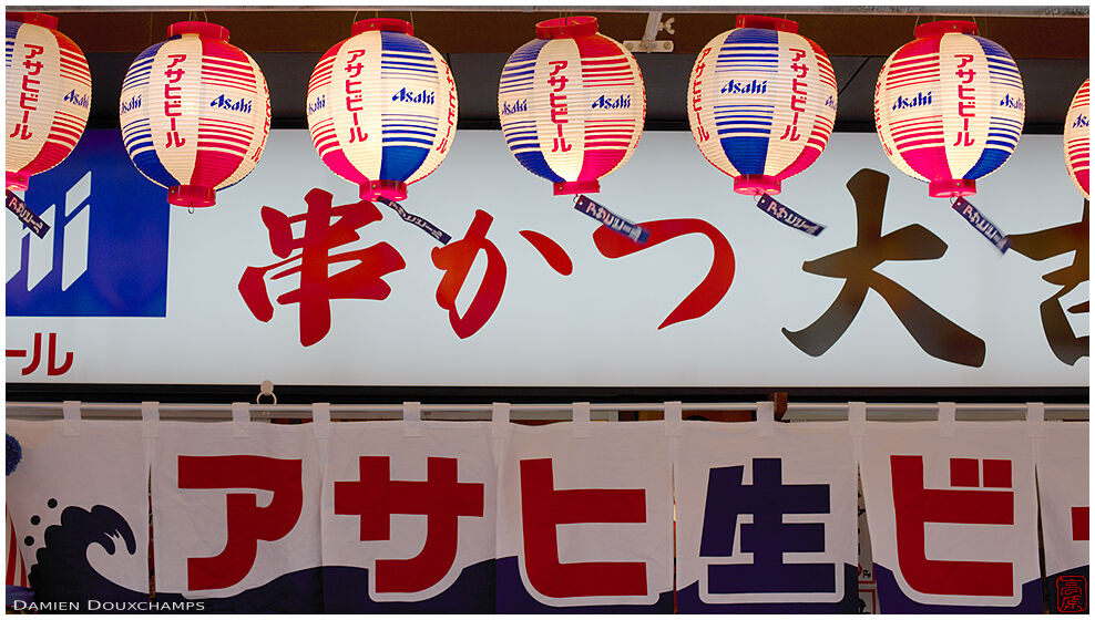 Brightly colored shop entrance where Asahi beer is definitely served, Osaka, Japan