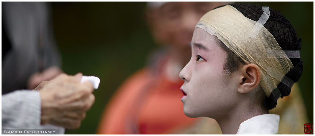 Child being prepped before the Jidai festival, Kyoto, Japan