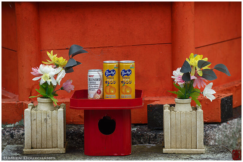 Juice and coffee cans as offerings in Gyokukei-ji temple, Shiga, Japan