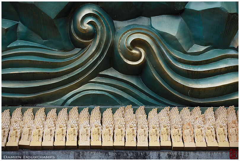Rows of sculpted wooden votive offerings in Gyokukei-ji temple, Shiga, Japan
