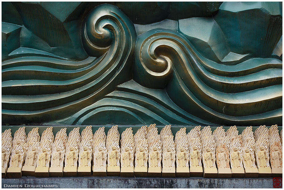 Rows of sculpted wooden votive offerings in Gyokukei-ji temple, Shiga, Japan