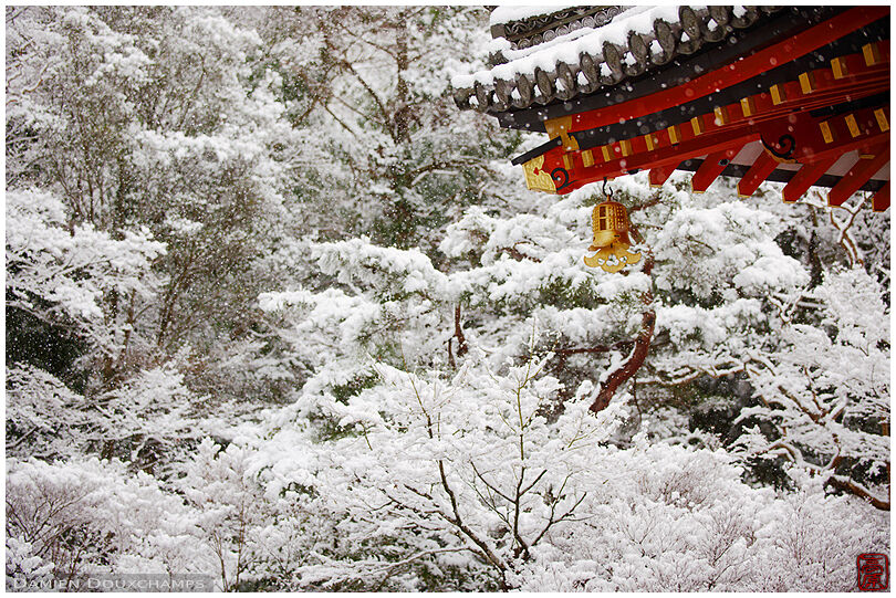 Bishamon-do roof and golden bells on a very snowy day, Kyoto, Japan