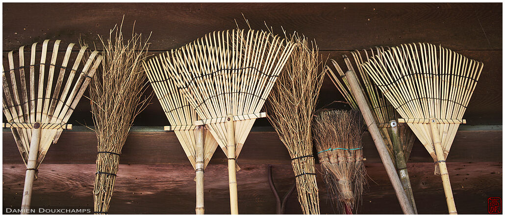 A collection of brooms and rakes in Hachidai-jinja shrine, Kyoto, Japan