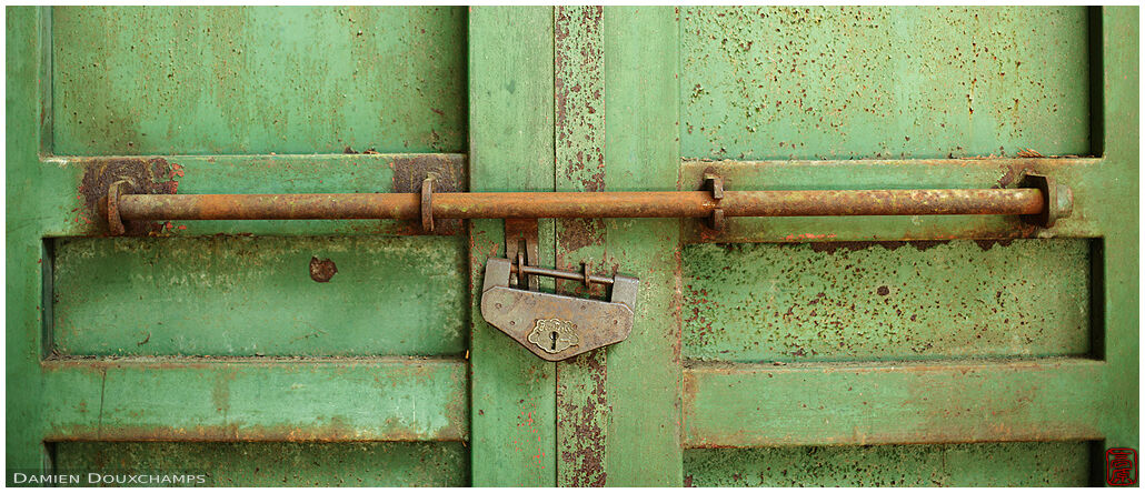Old door with old traditional Japanese padlock, Hachidai shrine, Kyoto, Japan