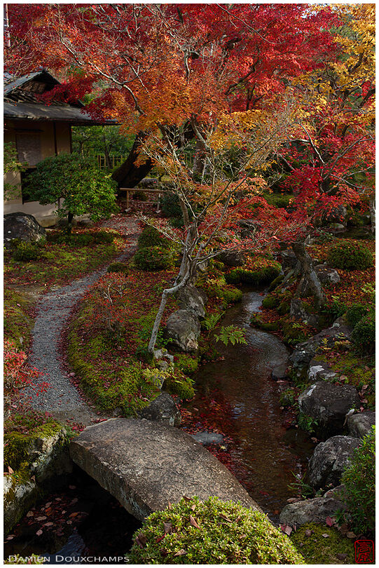 Stone bridge and path leading to tea house, Dainei-ken temple gardens, Kyoto, Japan