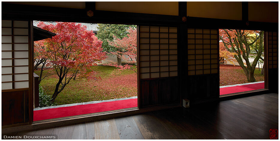 Two openings in the main hall of Myokaku-ji temple with view on autumn garden, Kyoto, Japan