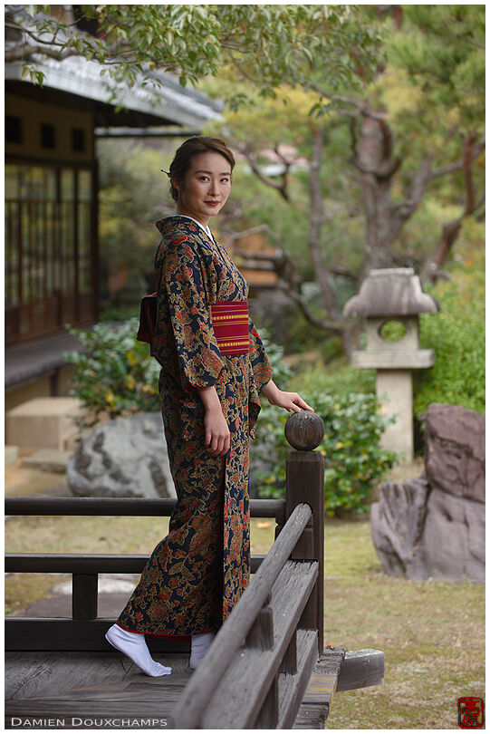 Woman in kimono on garden balcony, Shodensanso, Kyoto, Japan