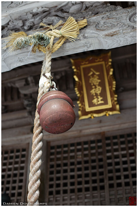 A bell hanging from an old temple hall, Miyama, Japan