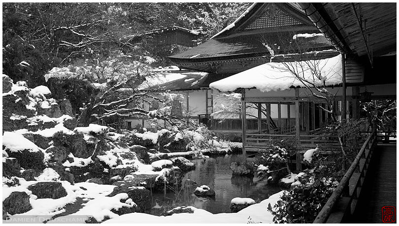 Snow covered pond garden in remote mountain temple of Joshoko-ji, Kyoto, Japan