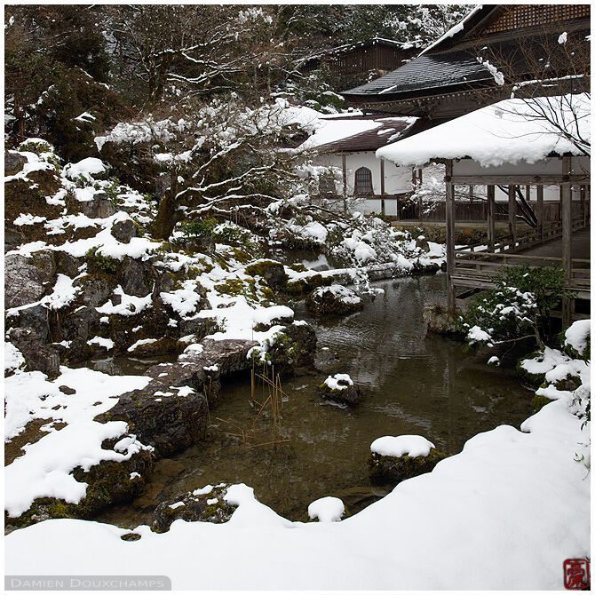 Snow covered pond garden in the mountain temple of Joshoko-ji, Kyoto, Japan