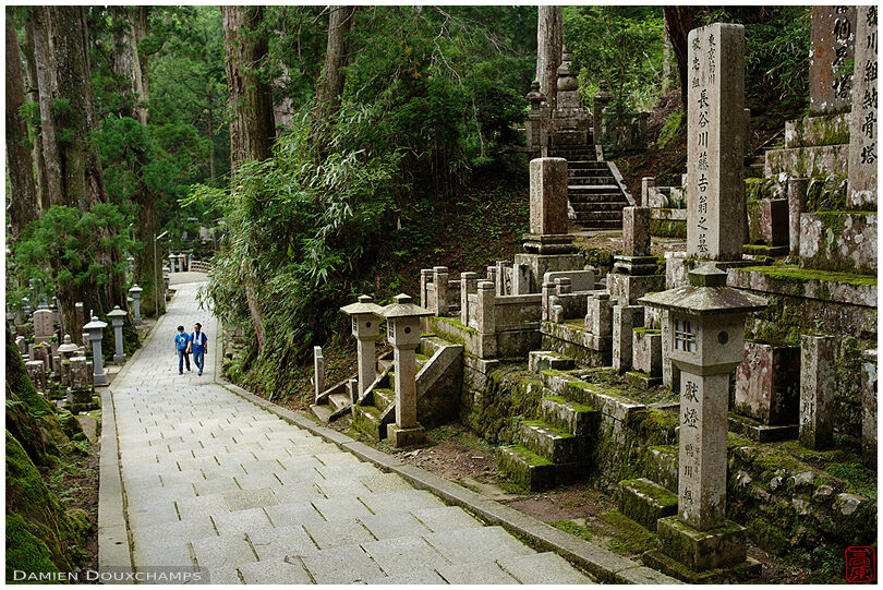 Two visitors strolling in Okunoin cemetery, Koyasan, Japan