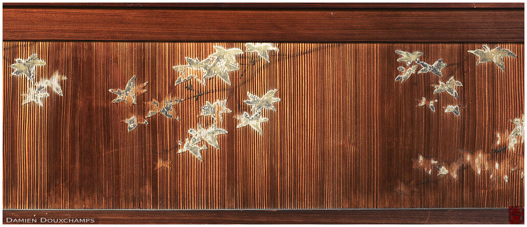 Faded maple leaves painting on wooden sliding door, Iwakura hermitage, Kyoto, Japan