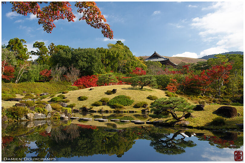 Mirror-like pond and autumn foliage in Isui-en garden, Nara, Japan