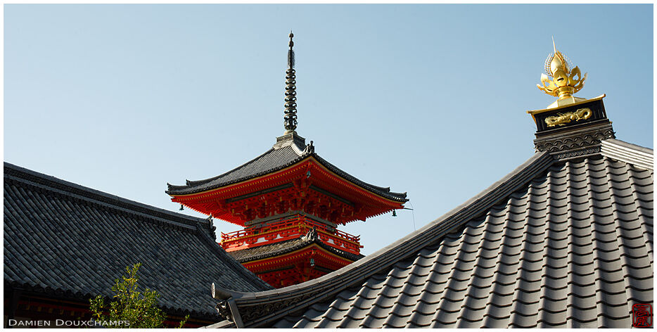 Red pagoda and golden roof ornament in Kiyomizu-dera temple, Kyoto, Japan