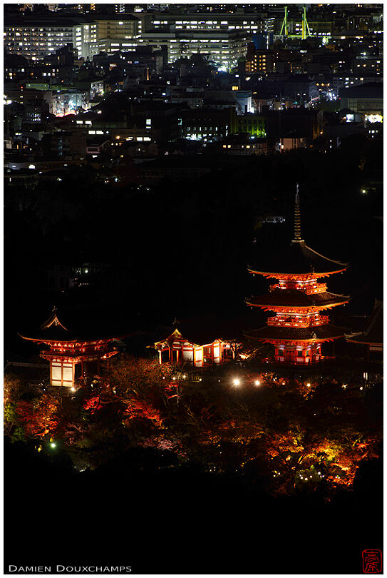 View of Kiyomizudera temple by night from a nearby mountain top, Kyoto, Japan