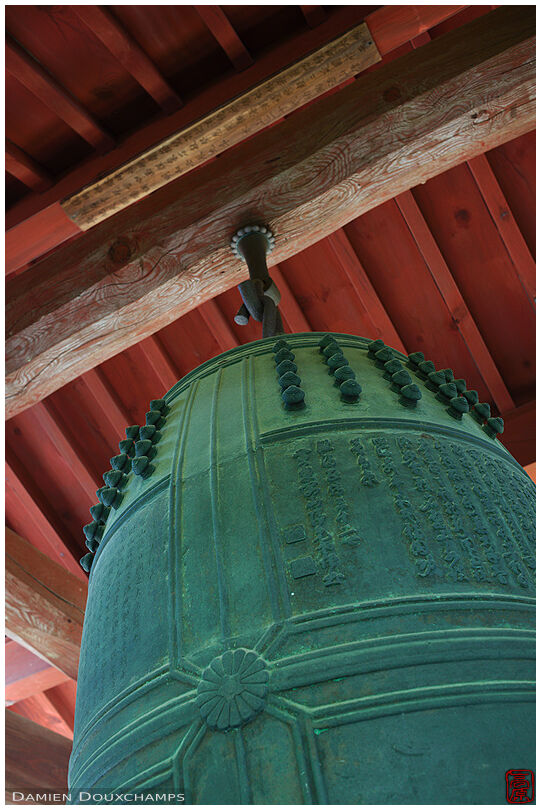 Large green bell under red wooden roof, Manpuku-ji temple, Kyoto, Japan