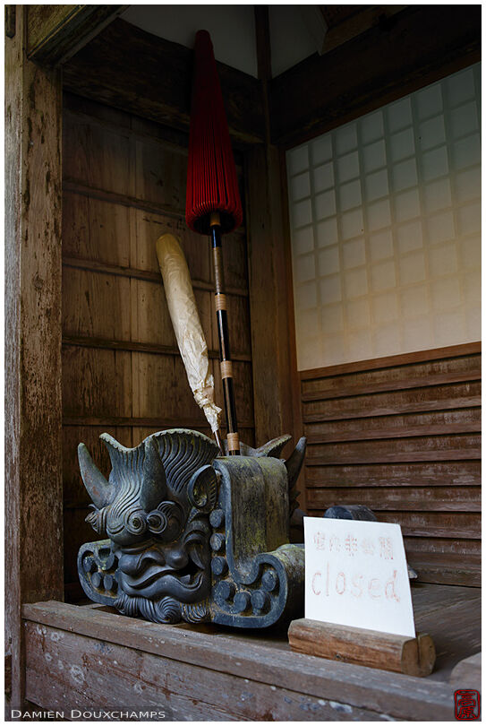 Traditional umbrella and tile roof header in Soren-ji, a remote temple in the mountains of Kyoto, Japan
