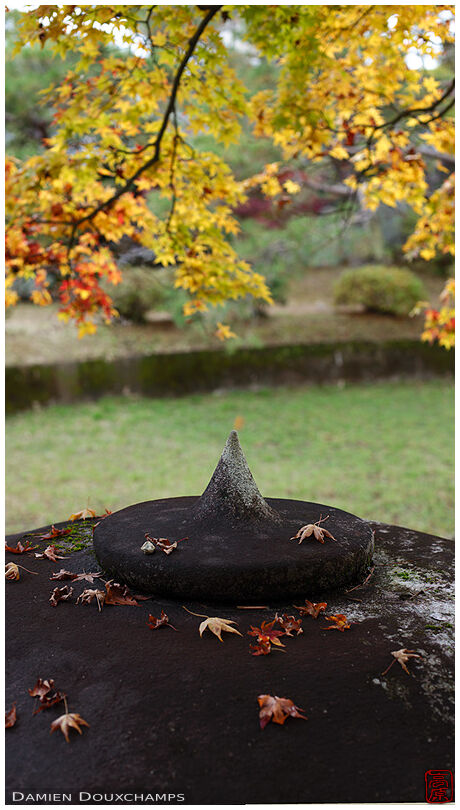 Pointy stone lantern hat in autumn, Shodensanso garden, Kyoto, Japan