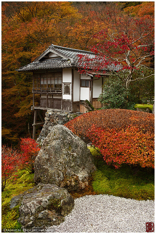 Autumn colours around perched traditional building in Amida-ji temple, Kyoto, Japan