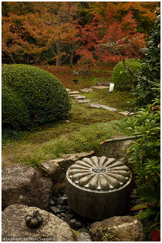 Sekimori stone and tsukubai water basin in the garden of Unryu-in temple, Kyoto, Japan