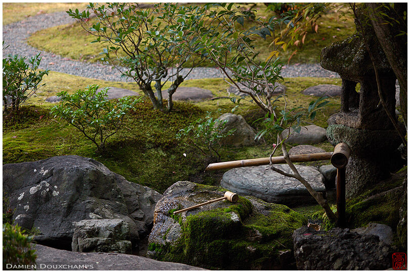 Tsukubai water basin with bamboo ladle just outside a tea room of the Seifu-so villa, Kyoto, Japan