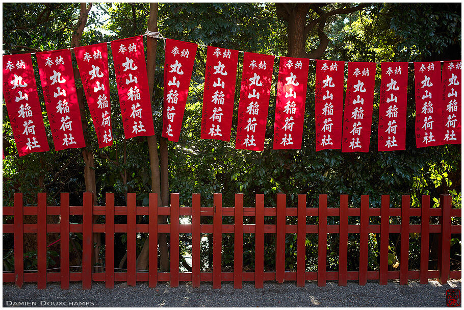 Bright red banners hanging in Tsurugaoka Hachimangu shrine, Kamakura, Japan