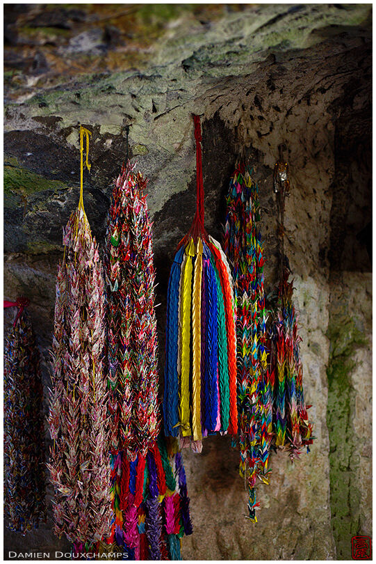 Collections of one thousand paper cranes hanging as offerings in the cave of the Zeniarai Benzaiten shrine, Kamakura, Japan