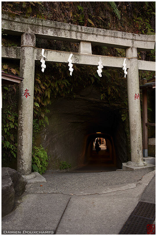 Stone torii gate guarding the underground passage to Zeniarai Benzaiten shrine, Kamakura, Japan