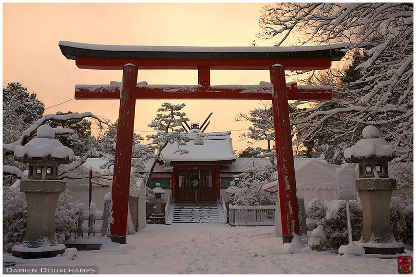 Early morning light in snow-covered Yoshida shrine, Kyoto, Japan