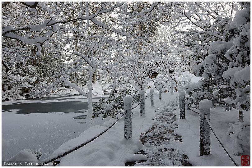Tenju-an temple pond garden after heavy snowfall, Kyoto, Japan