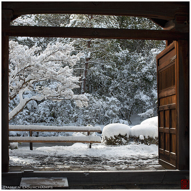 Gate at the entrance of Konchi-in temple gardens on a snowy day, Kyoto, Japan