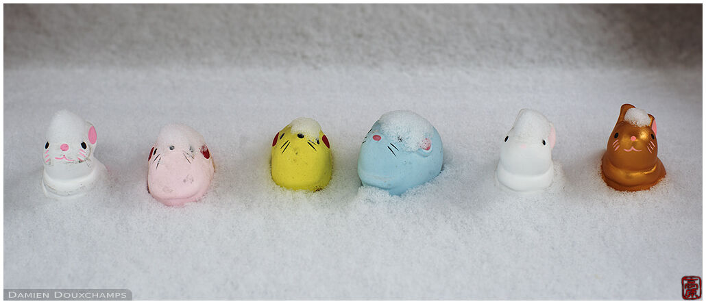 Small cute rat votive offerings in snow, Otoyo-jinja, Kyoto, Japan