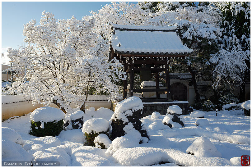 Thick snow cover on the garden and belfry of Shozen-ji temple, Kyoto, Japan