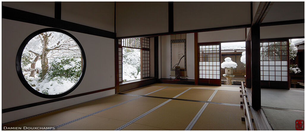 Snow-covered Japanese garden viewed through multiple windows, Genko-an temple, Kyoto, Japan