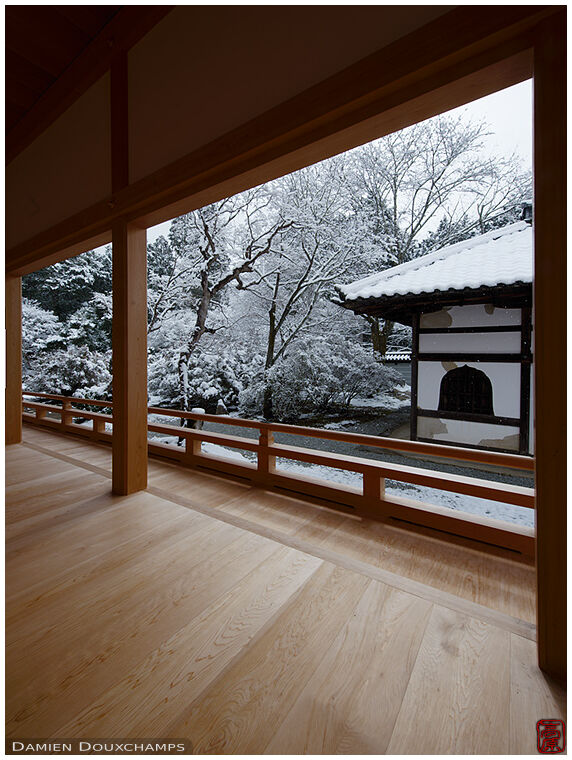 Pristine new building wooden terrace with view on snowy garden in Manshuin Monzeki temple, Kyoto, Japan