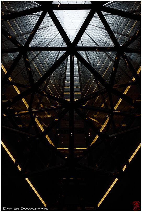 Looking up into the hollow triangular core of the Sumitomo building in Shinjuku, Tokyo, Japan