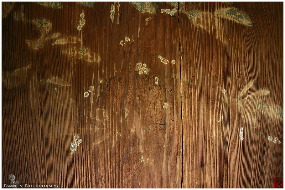 Fading paintings on a wooden door in Chogaku-ji temple, Nara, Japan